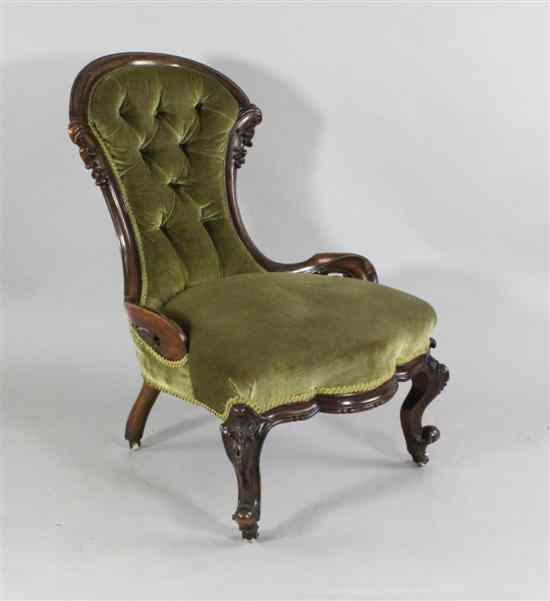 Appraisal: A Victorian carved walnut button back salon chair on cabriole