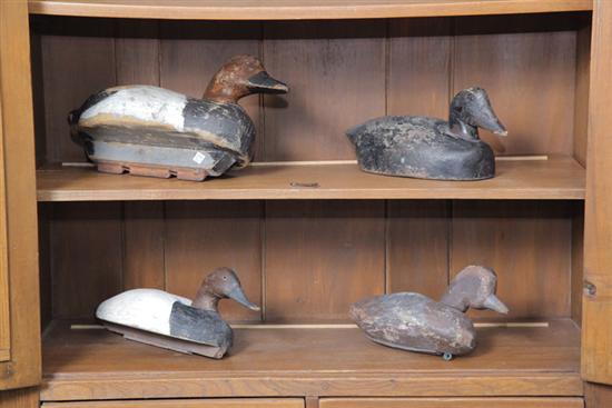 Appraisal: GROUP OF FOUR CARVED AND PAINTED WOODEN DUCK DECOYS One