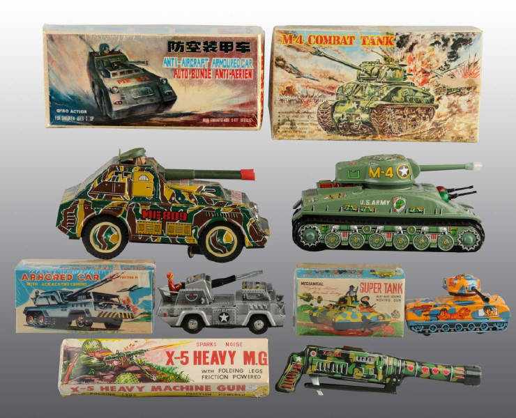 Appraisal: Lot of Tin Litho Military Toys Description Japanese Working Includes