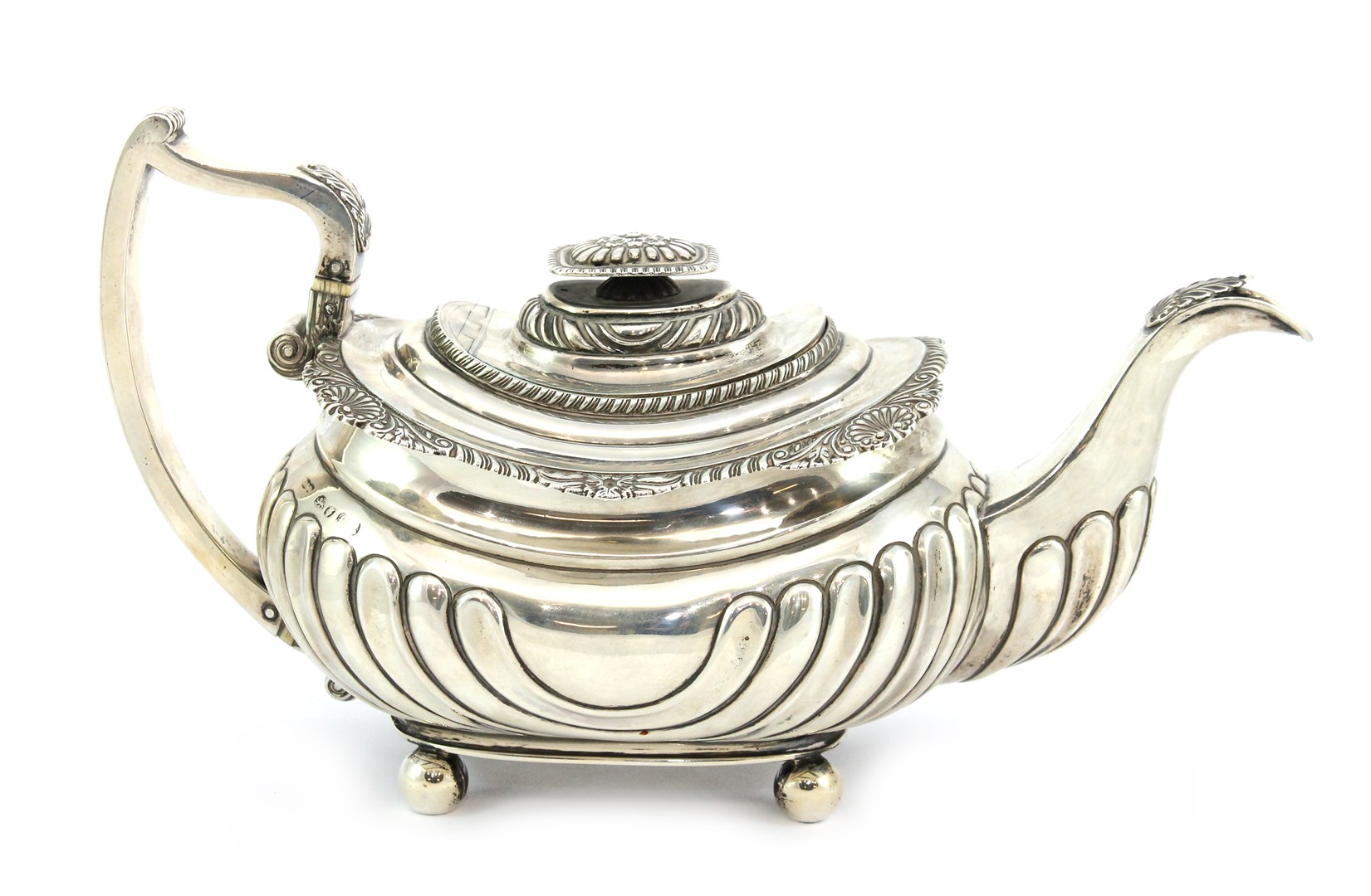 Appraisal: A George IV silver teapot of compressed oval form with