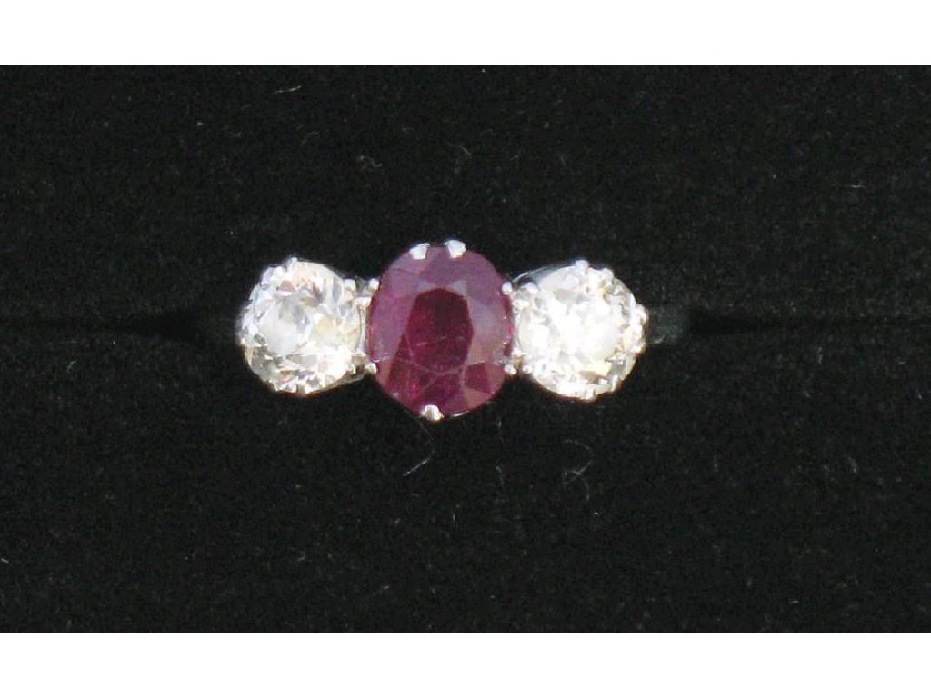 Appraisal: A THREE STONE DIAMOND AND RUBY DRESS RING the central