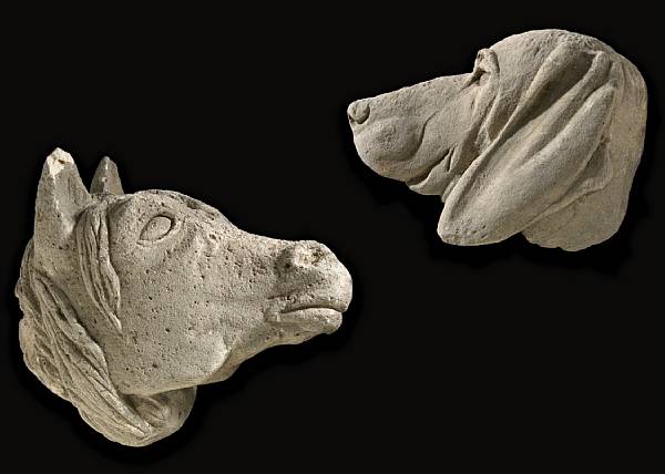 Appraisal: Two limestone heads of a horse and hound th century