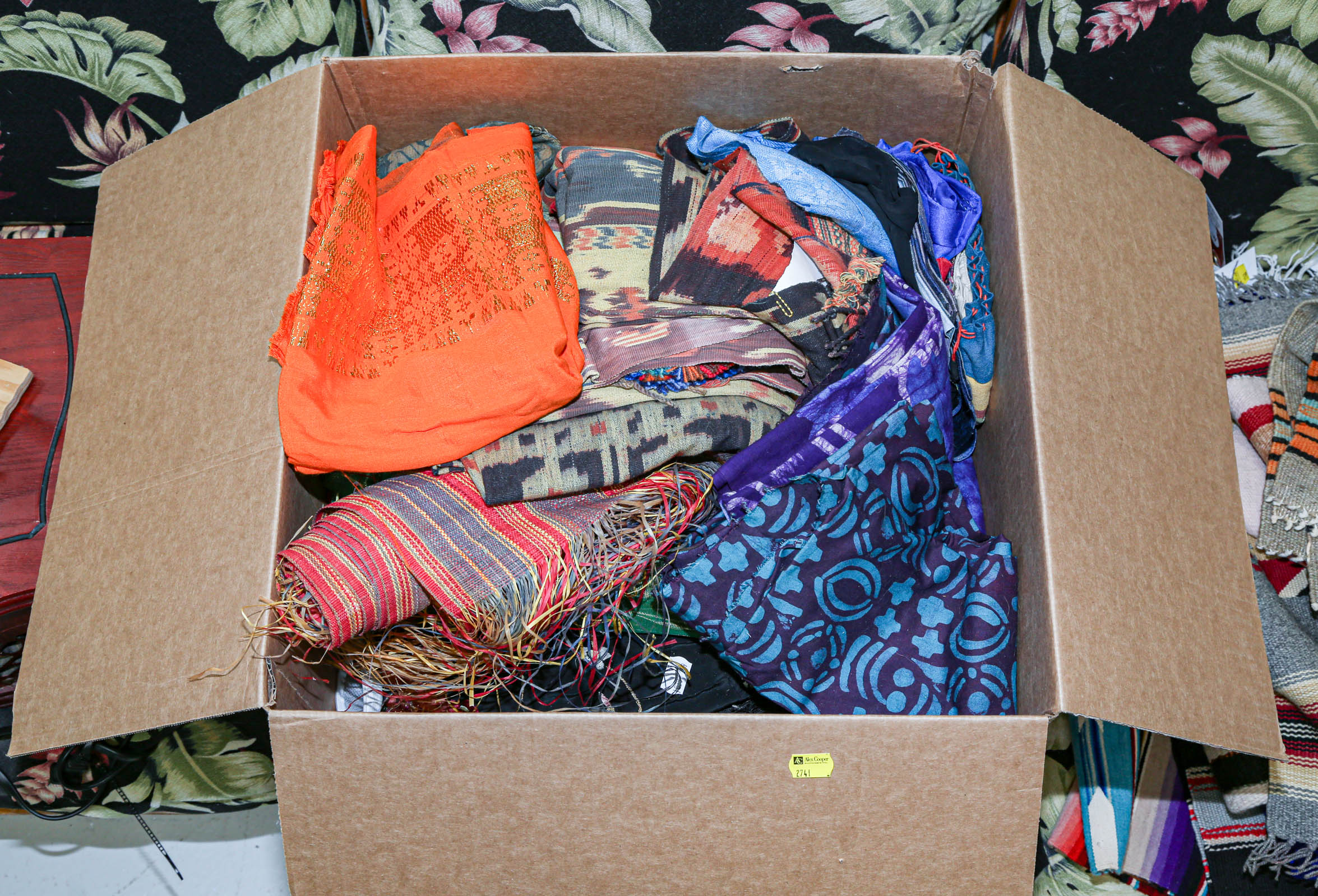 Appraisal: BOX OF ETHNOGRAPHIC TEXTILES Including two Indonesian Ikat sarongs Rajasthani