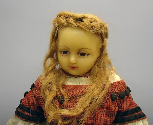 Appraisal: Poured wax shoulderhead doll Stationary brown glass eyes closed mouth