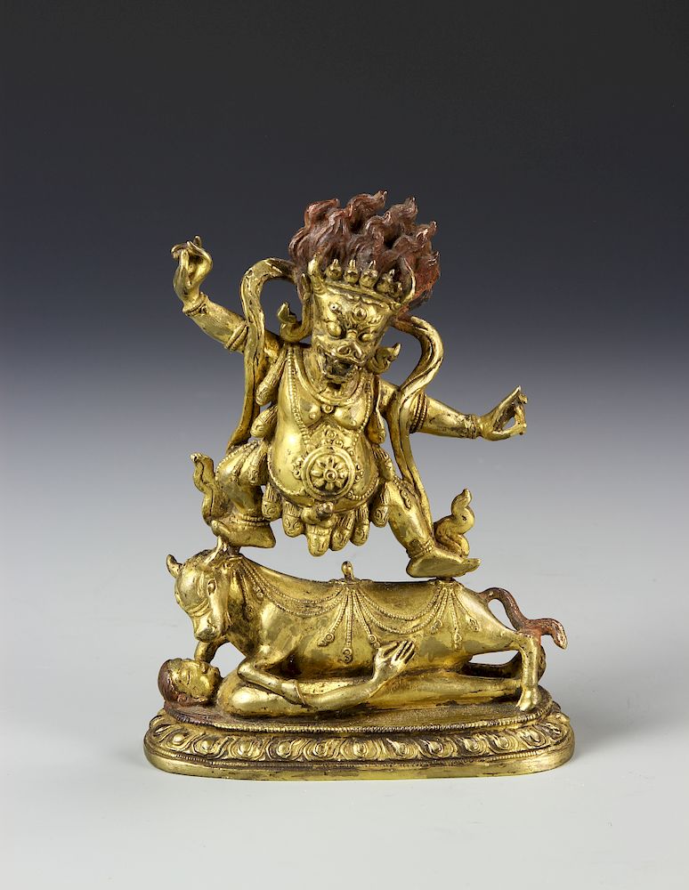 Appraisal: Tibetan Gilt-Bronze Figure of Buddha th C fierce looking Buddha