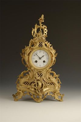 Appraisal: A gilt brass mantel clock the French drum movement with