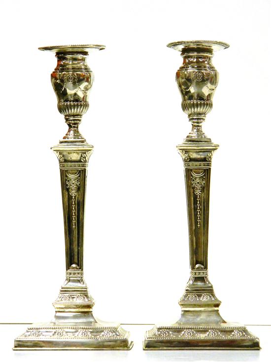 Appraisal: Pair Neo-Classical style silver weighted candlesticks square base urn form