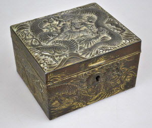 Appraisal: An oriental gilt metal casket cast in relief with dragon