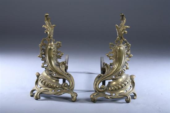 Appraisal: PAIR LOUIS XV STYLE BRASS CARTOUCHE-FORM CHENETS late th century