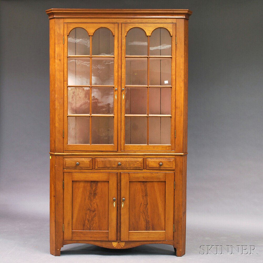 Appraisal: Two-piece Cherry Glazed Corner Cupboard the upper sections with flat-molded