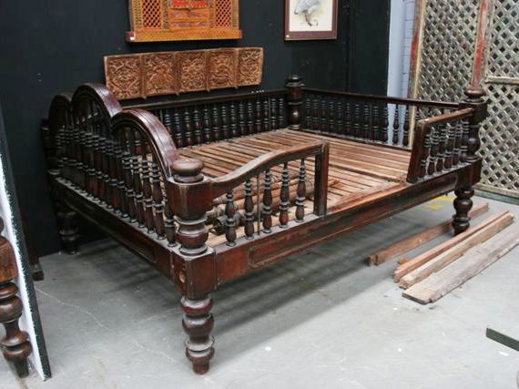 Appraisal: A four poster Calcutta bed headboard footboard and side panels