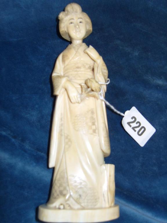 Appraisal: A th century Japanese carved ivory figure of a maiden