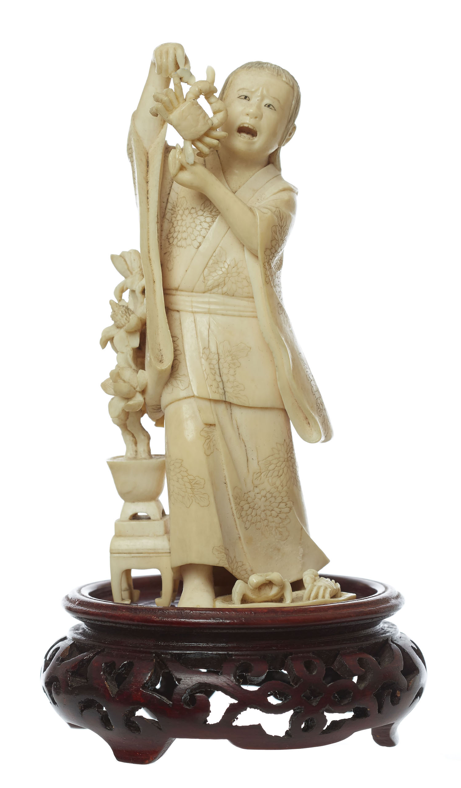 Appraisal: A JAPANESE CARVED IVORY FIGURE 'THE CRAB SELLER' LATE MEIJI