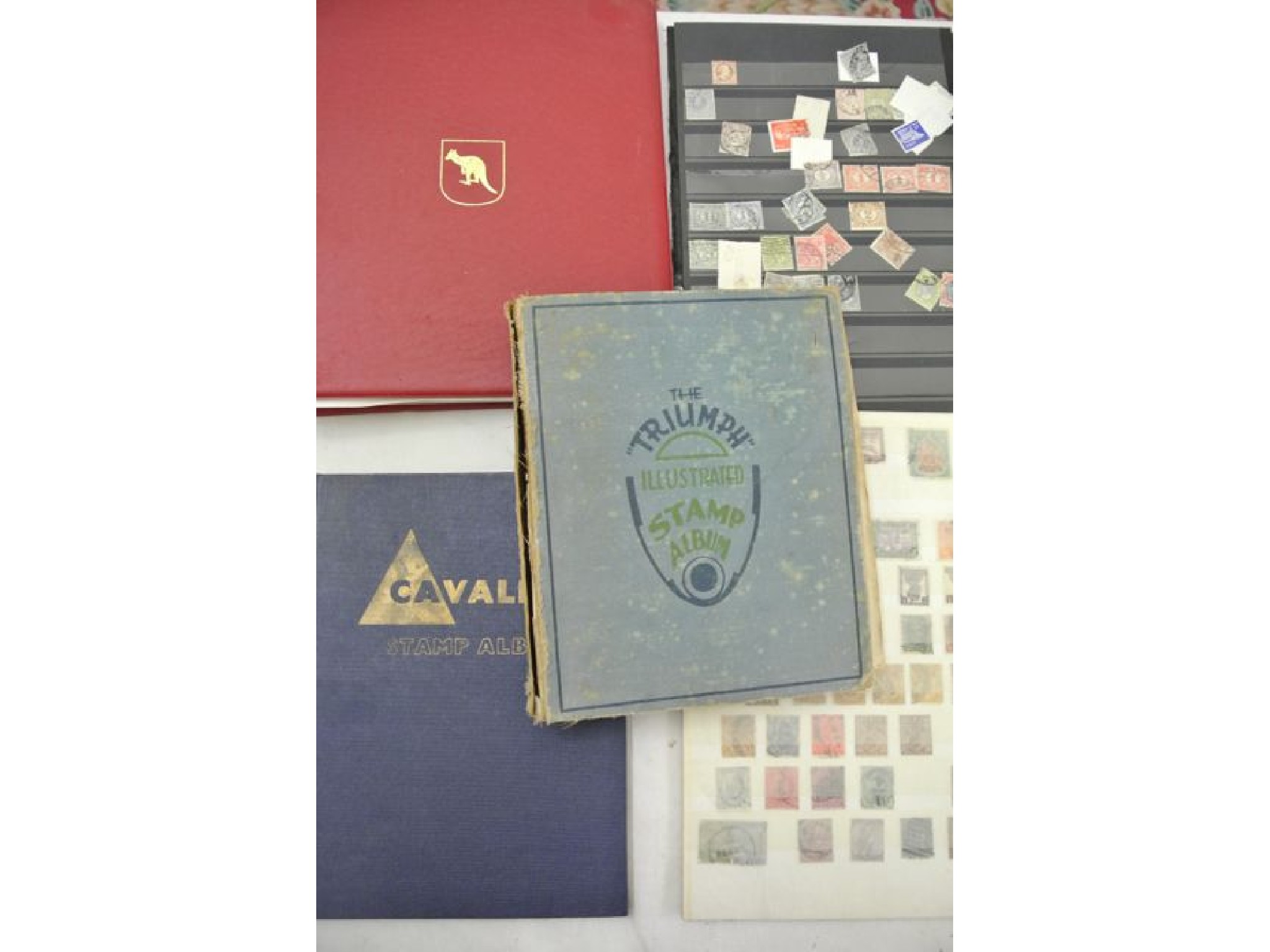 Appraisal: The Triumph Illustrated Stamp Album containing stamps from the mid-