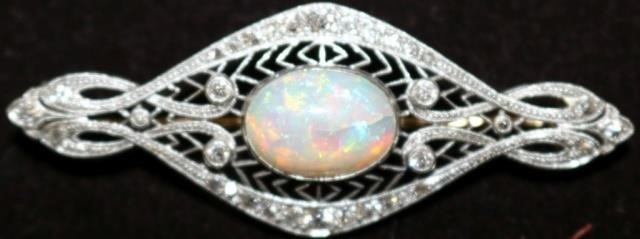 Appraisal: ART DECO PLATINUM AND DIAMOND PIN WITH LARGEFIERY OPAL CENTER