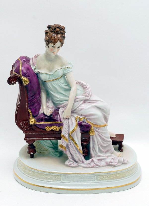 Appraisal: Porcelain figure of lady in flowing garments lounging on settee