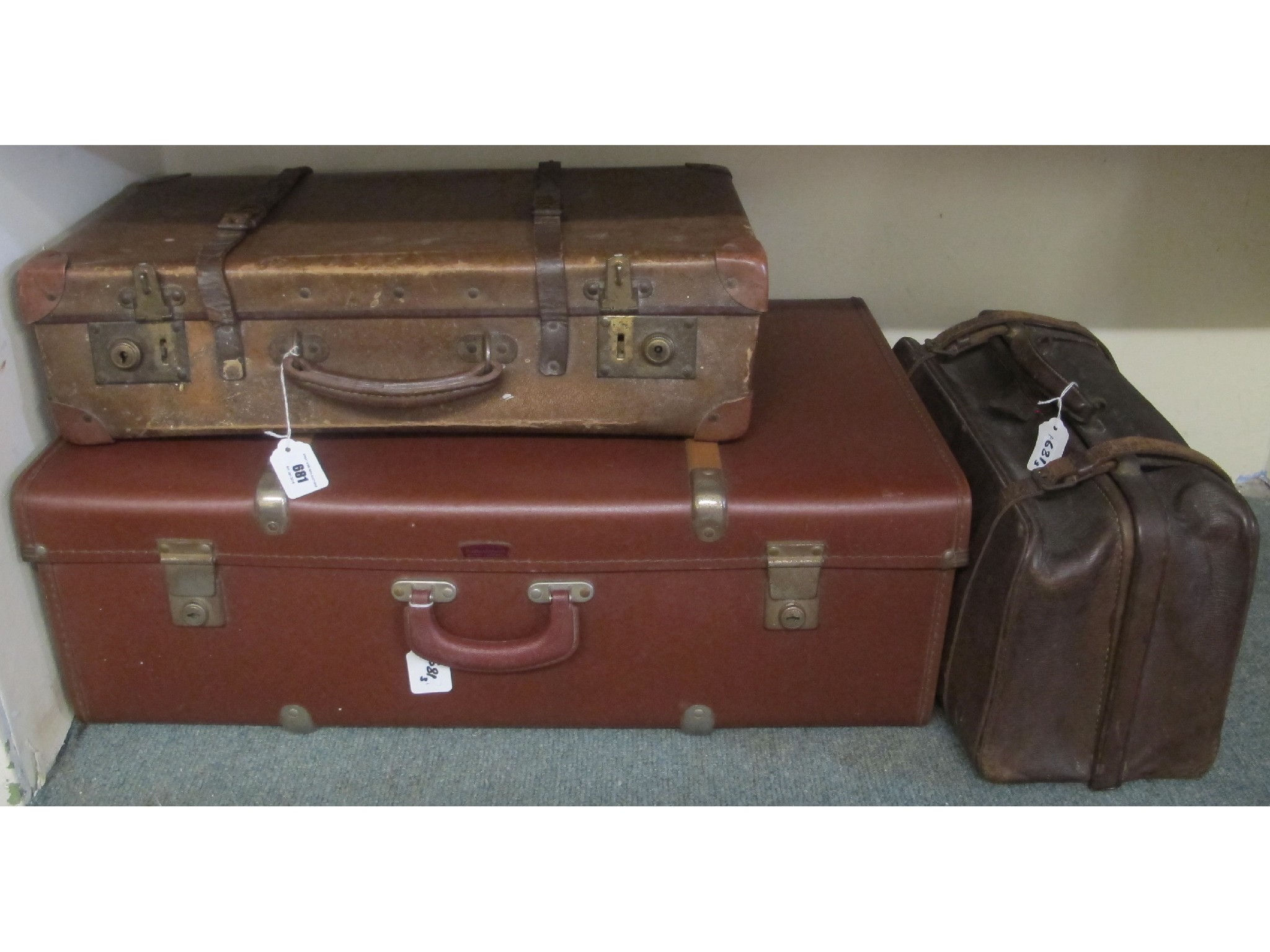 Appraisal: Two vintage leather travel cases and a Gladstone bag