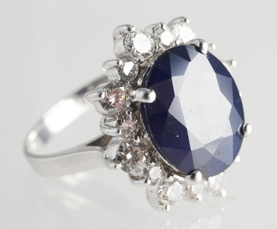 Appraisal: Carat oval sapphire with round brilliant cut diamonds cttw k