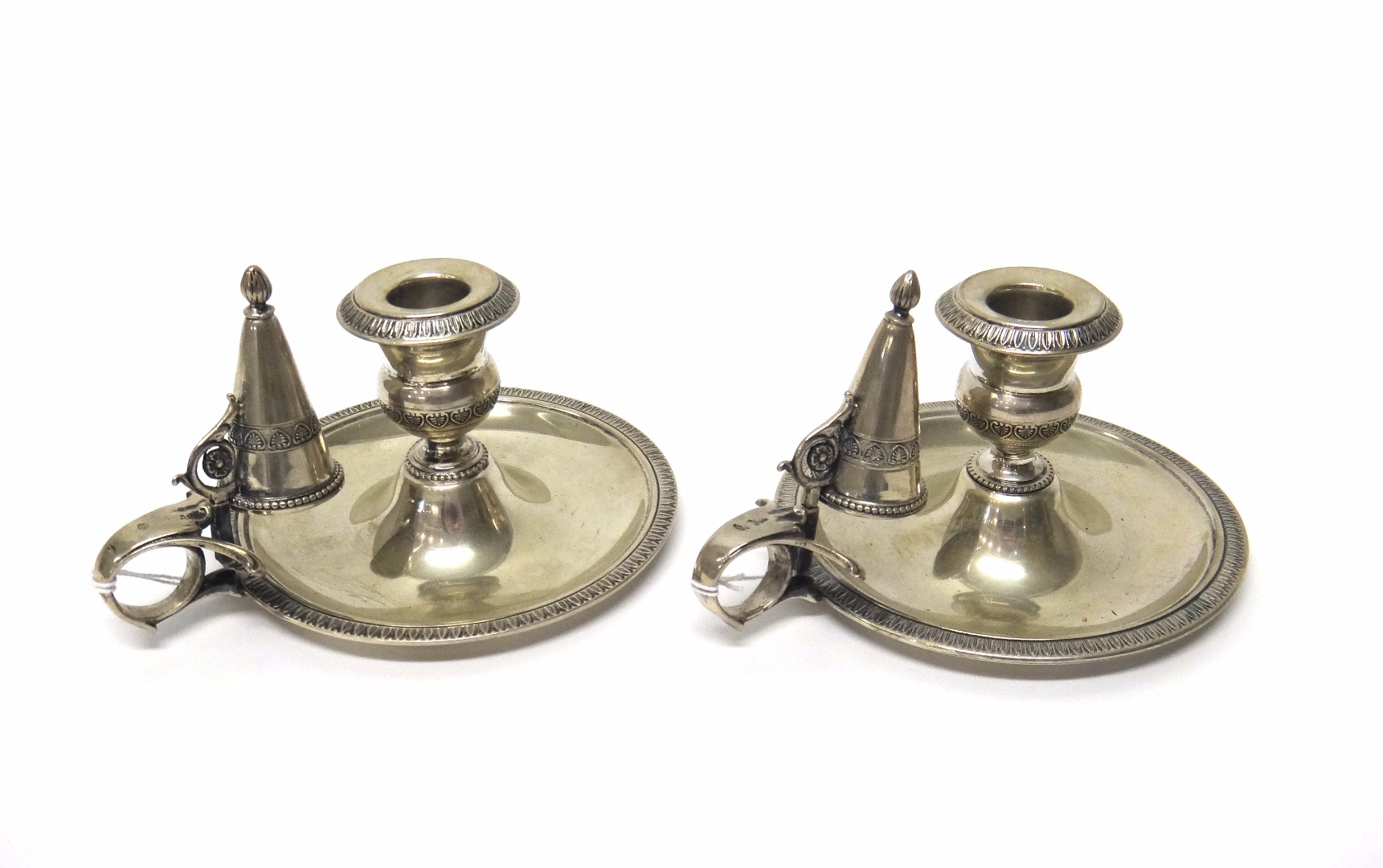 Appraisal: A pair of th century European chambersticks in the Georgian