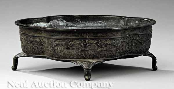 Appraisal: An Antique Japanese Bronze Suiban Flower Basin the quatrefoil body