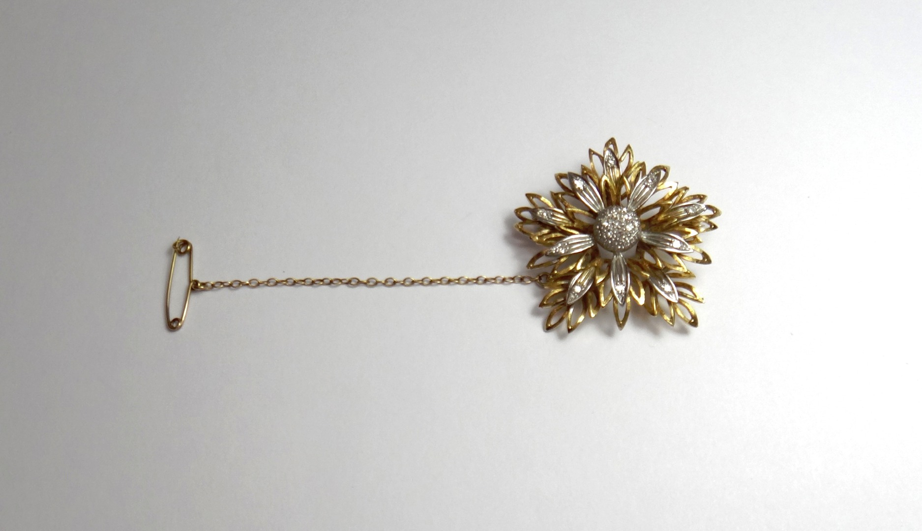 Appraisal: An ct gold and diamond set brooch designed as a