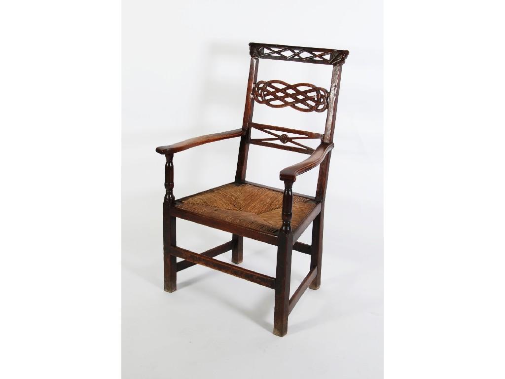 Appraisal: NINETEENTH CENTURY PROVINCIAL CARVED OAK OPEN ARMCHAIR the pierced top