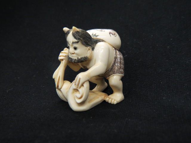 Appraisal: Carved Ivory Netsuke of Futen god of wind holding a