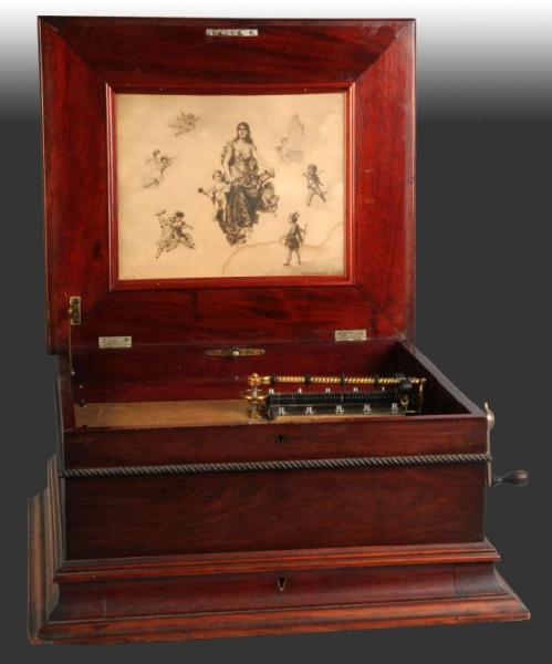 Appraisal: Mahogany Double Comb Music Box Description Plays - metal discs