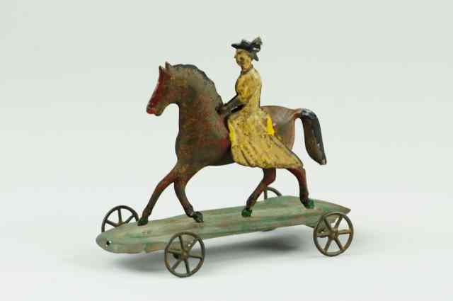 Appraisal: WOMAN RIDING HORSE PULL TOY Attributed to Hull Strafford early