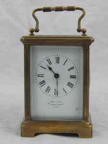 Appraisal: A French carriage clock with white enamelled dial ht cm