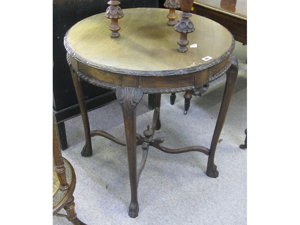 Appraisal: Edwardian mahogany occasional table on hairy paw feet