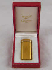 Appraisal: Cartier A gold plated cigarette lighter signed Cartier Paris and