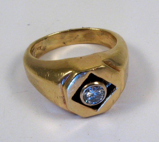 Appraisal: DIAMOND AND FOURTEEN KARAT GOLD RING set with a round