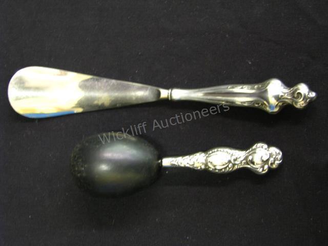 Appraisal: Two Sterling Dresser Items darning ball and shoehorn with sterling