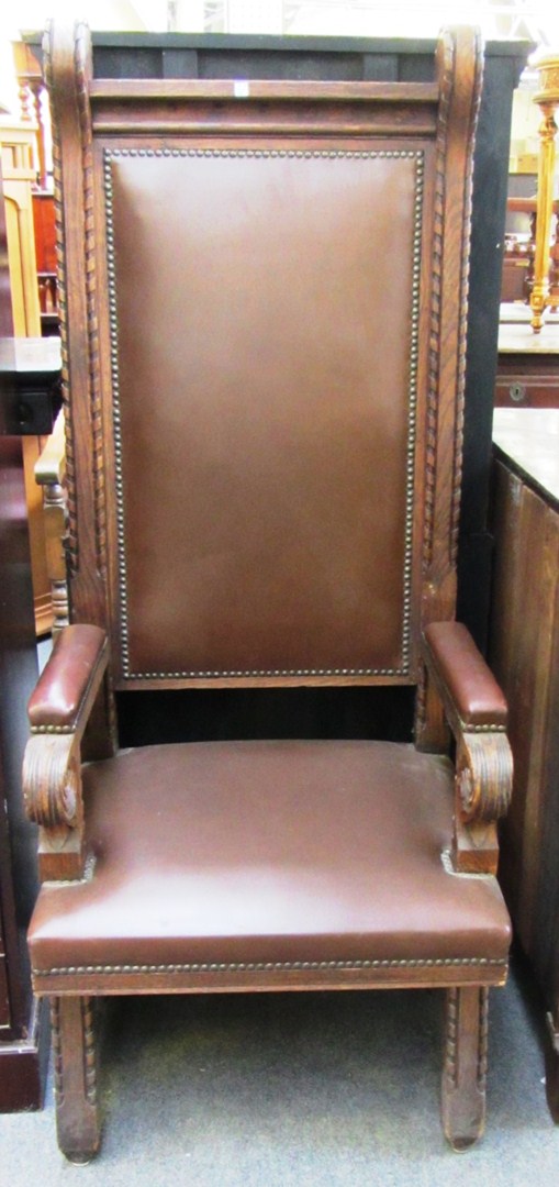 Appraisal: A pair of oak high back throne chairs with semi