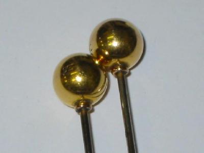 Appraisal: A PAIR OF CT GOLD HAT PINS the plain ball