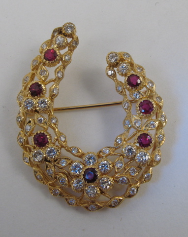 Appraisal: RUBY AND DIAMOND BROOCH k yellow gold and set with