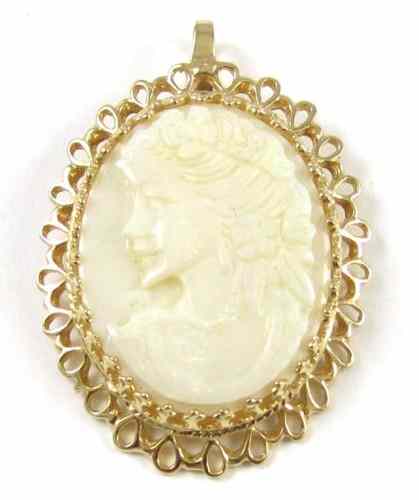 Appraisal: CARVED WHITE OPAL CAMEO PENDANT set in k yellow gold