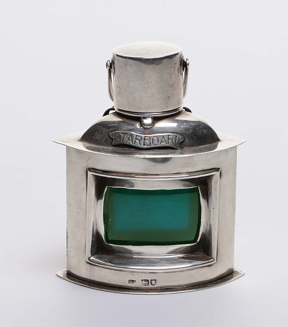 Appraisal: A SILVER CIGAR LIGHTER in the form of a starboard