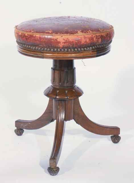 Appraisal: A VICTORIAN ROSEWOOD CIRCULAR ADJUSTABLE PIANO STOOL on tripod support