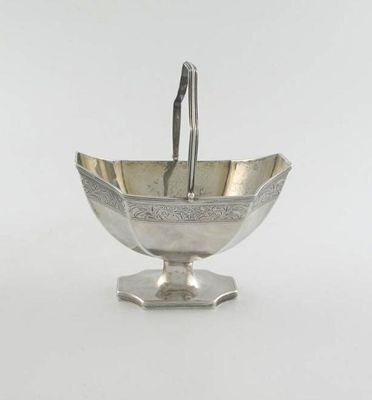 Appraisal: A George III boat-shaped sugar basket with a pedestal base