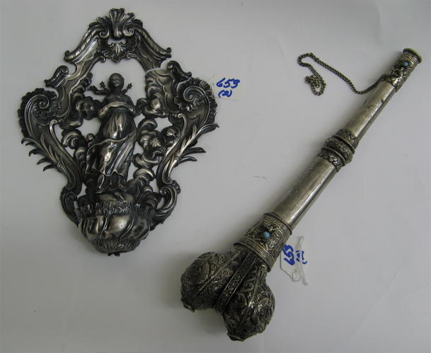 Appraisal: TWO UNUSUAL SILVER-ALLOY PIECES a wall mounted figural holy water