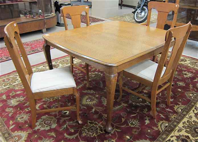 Appraisal: AN OAK QUEEN ANNE REVIVAL DINING TABLE AND CHAIR SET