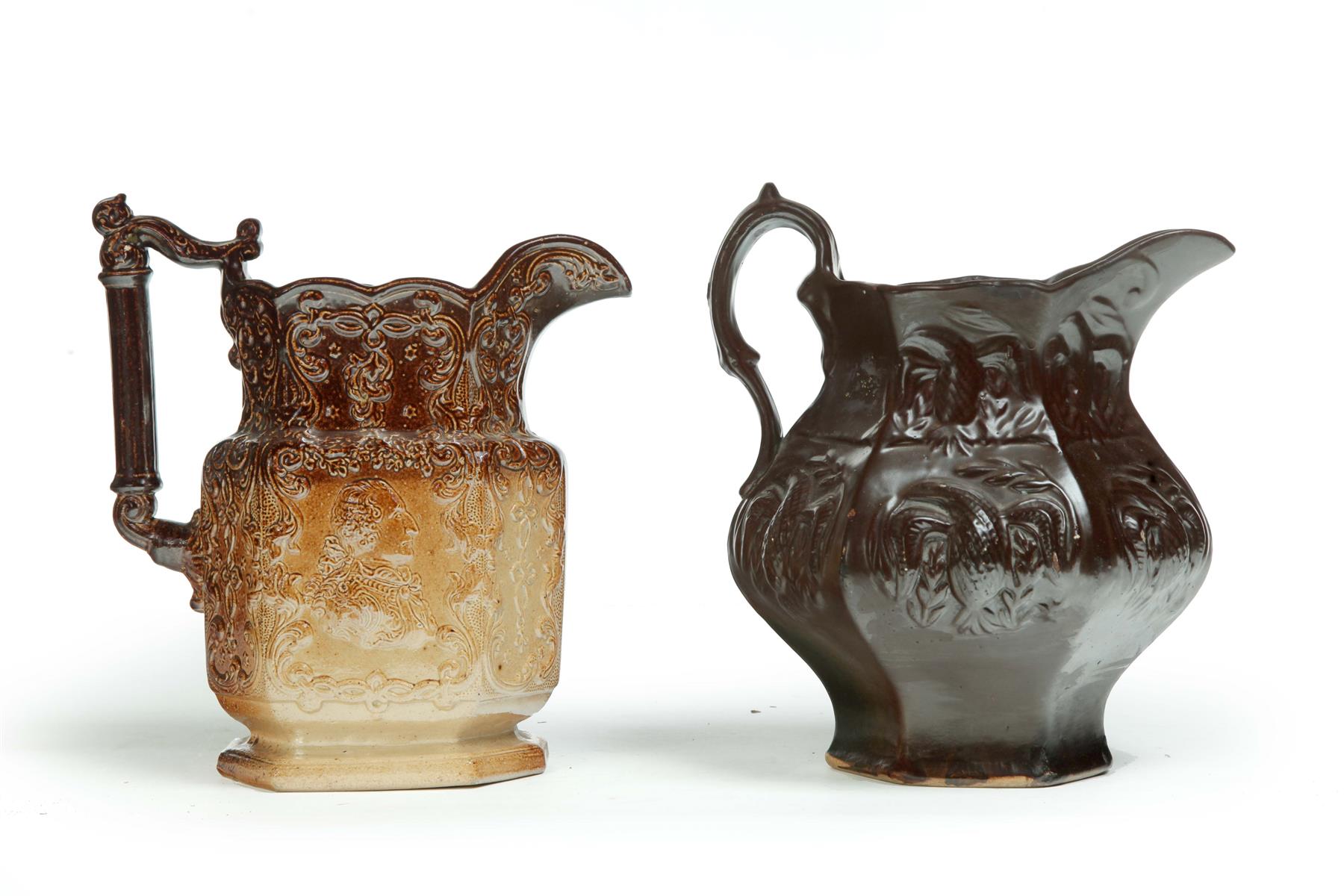 Appraisal: TWO AMERICAN-THEMED PITCHERS Mid th century Albany slip with embossed