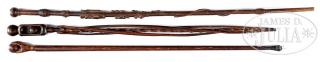 Appraisal: GROUP OF THREE CARVED WALKING STICKS th century American Carved