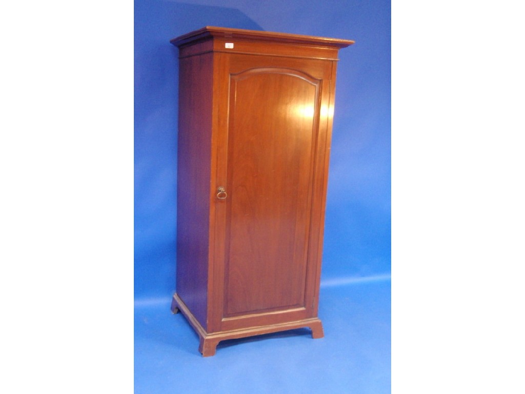 Appraisal: A small mahogany hall robe enclosed by a single door