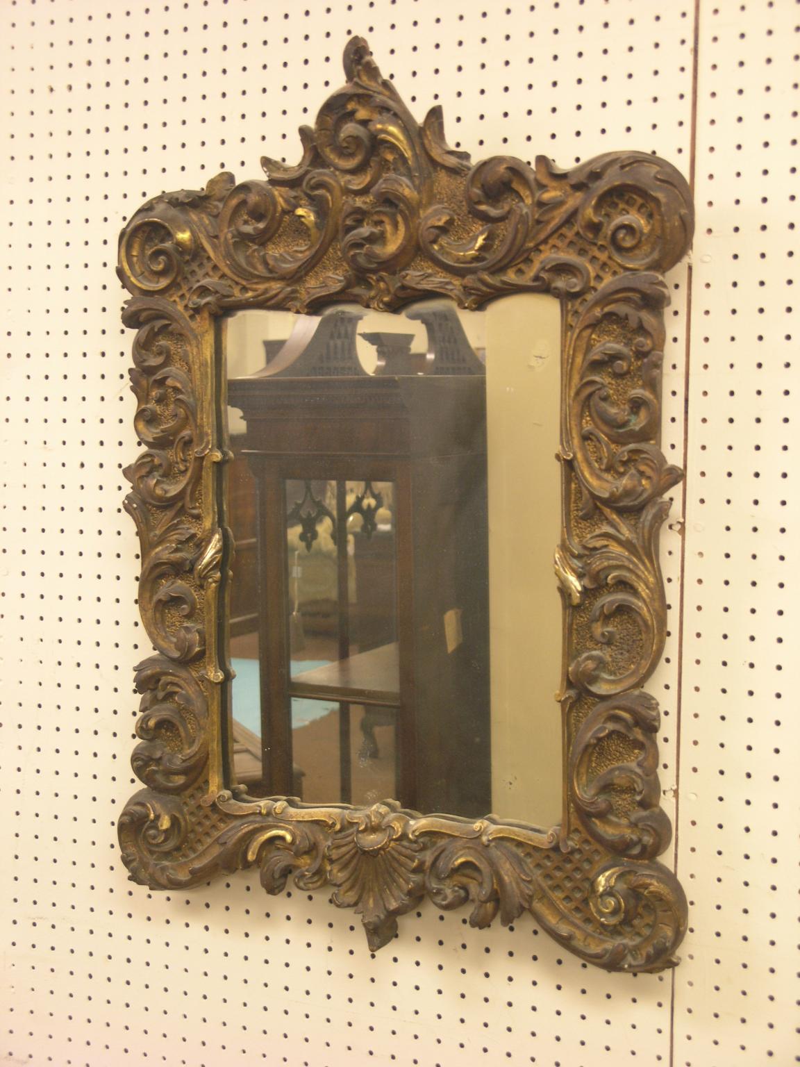 Appraisal: A th century gilt mirror rectangular-shape moulded with leaf-scrolls ft