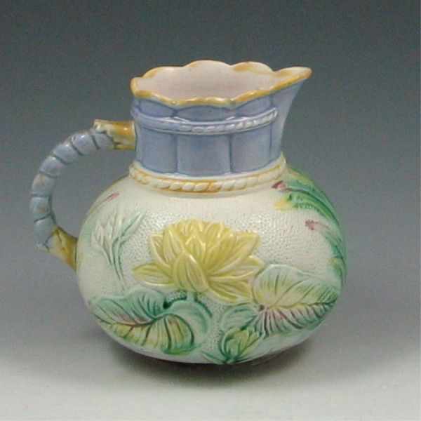 Appraisal: Majolica Flowered Pitcher marked with impressed two small glaze chips