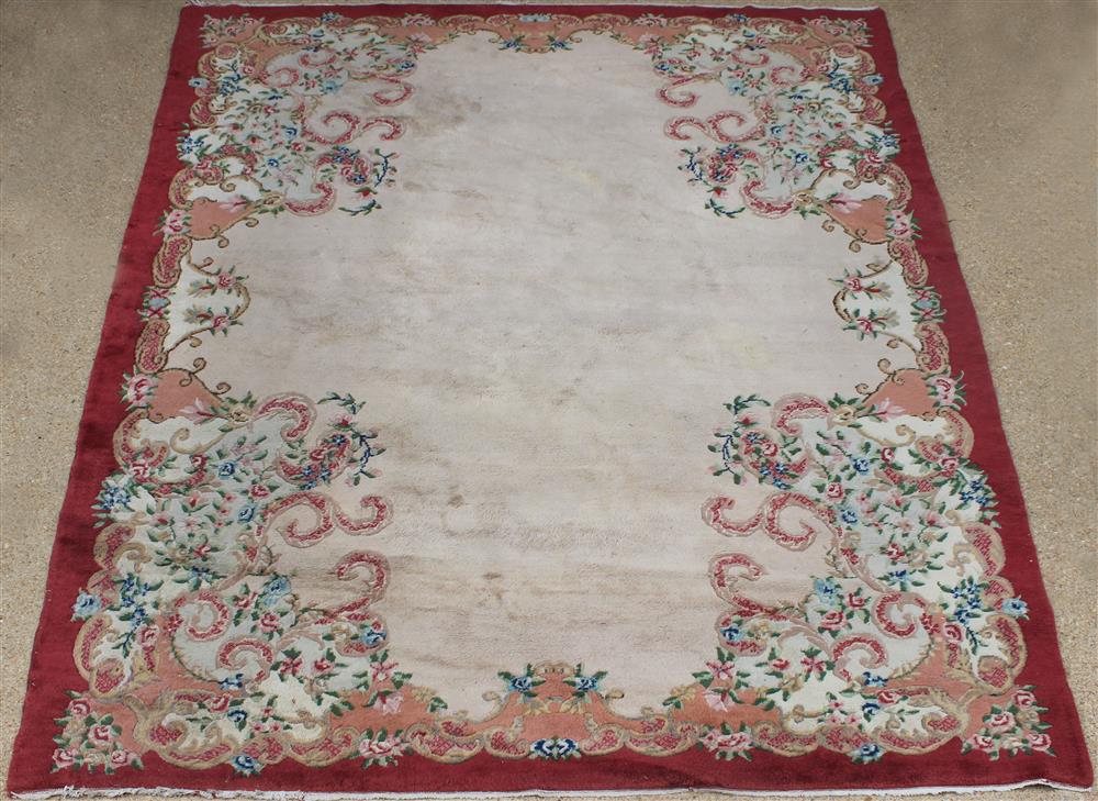 Appraisal: LARGE CHINESE CARVED WOOL RUG floral design as corner brackets