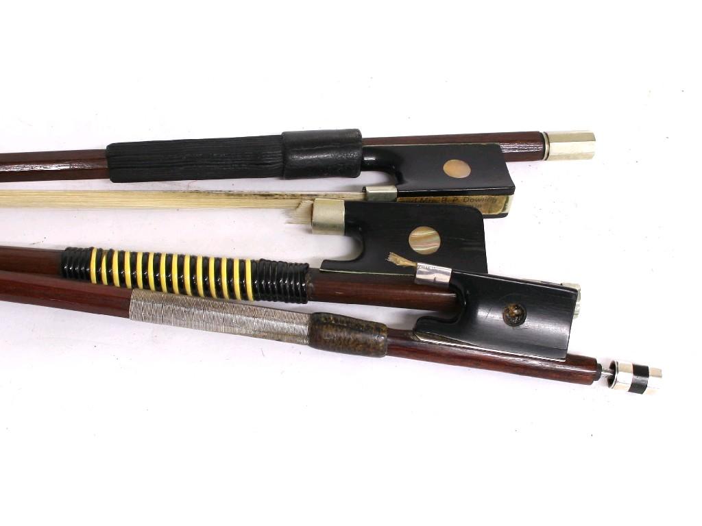 Appraisal: Two nickel mounted violoncello bows and a violin bow